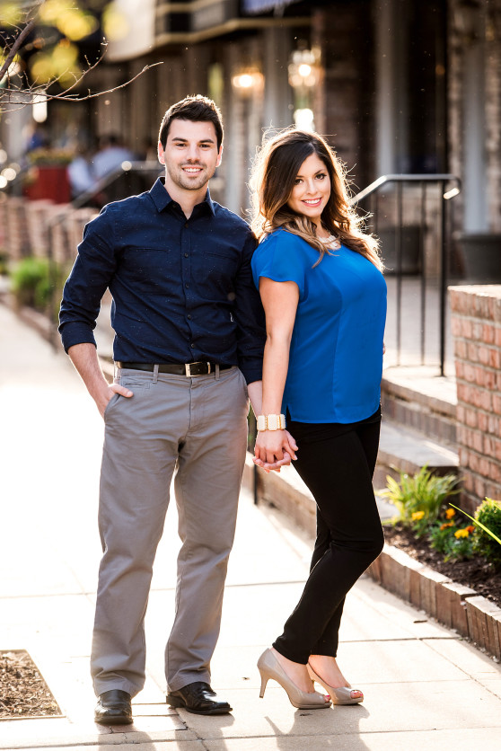 Photo of couple standing on street of downtown Clayton
