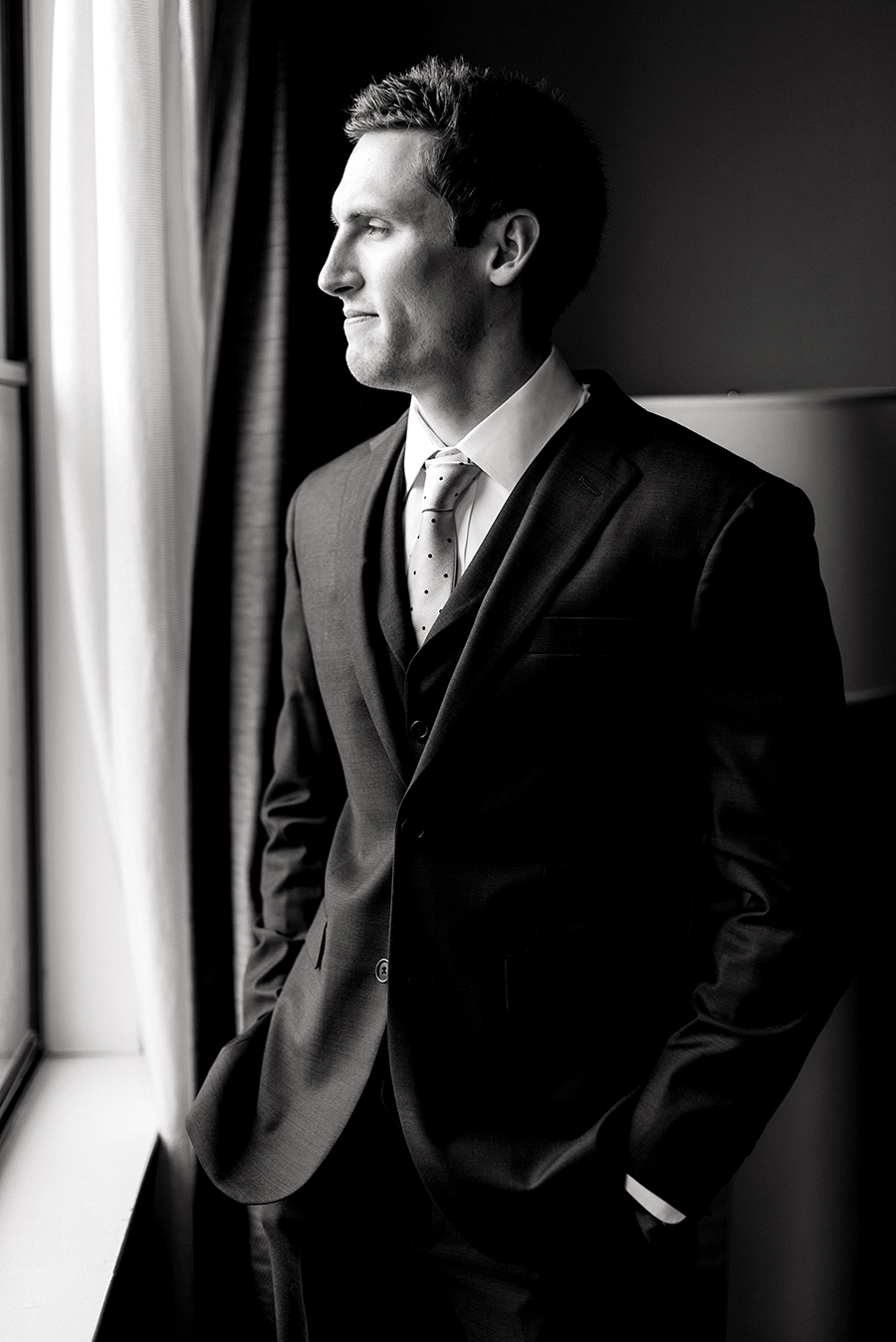 groom getting ready at the chase park plaza for a winter wedding at graham chapel by ashley fisher photography