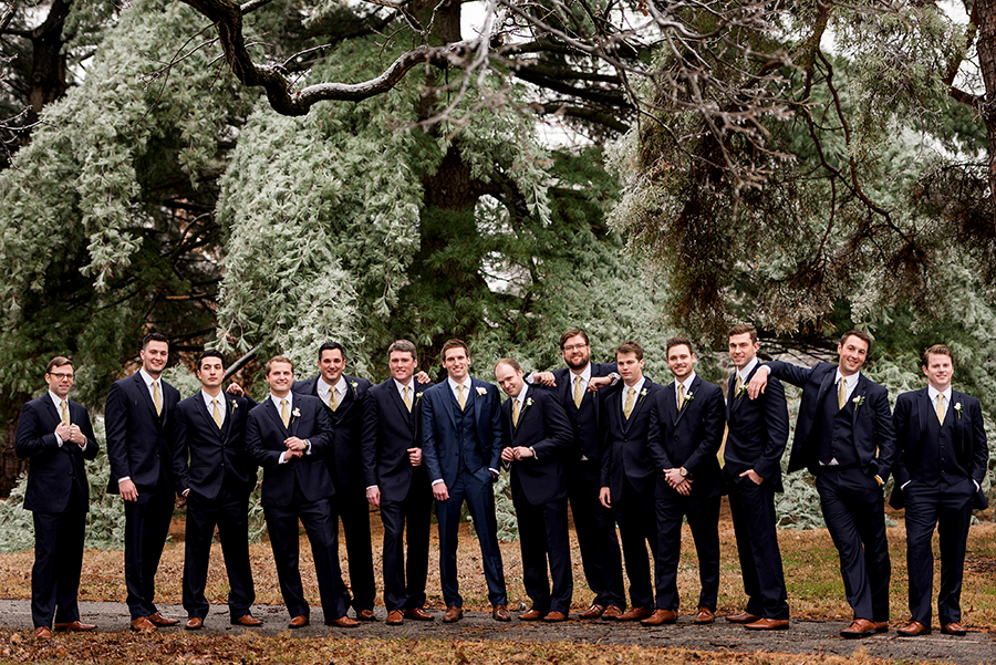 groomsmen during ice storm for a winter wedding at graham chapel by ashley fisher photography