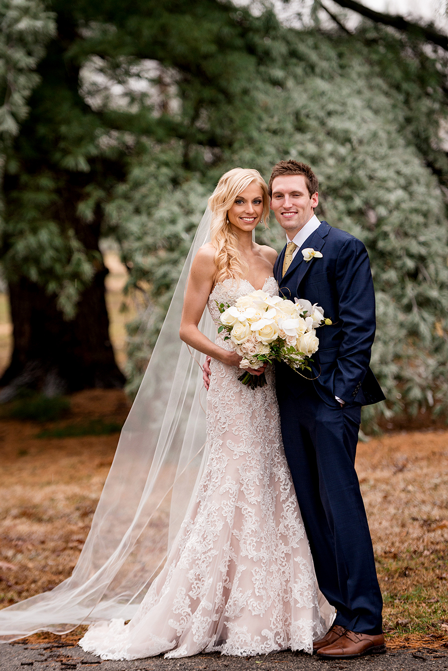 bride and groom during ice storm for a winter wedding at graham chapel by ashley fisher photography
