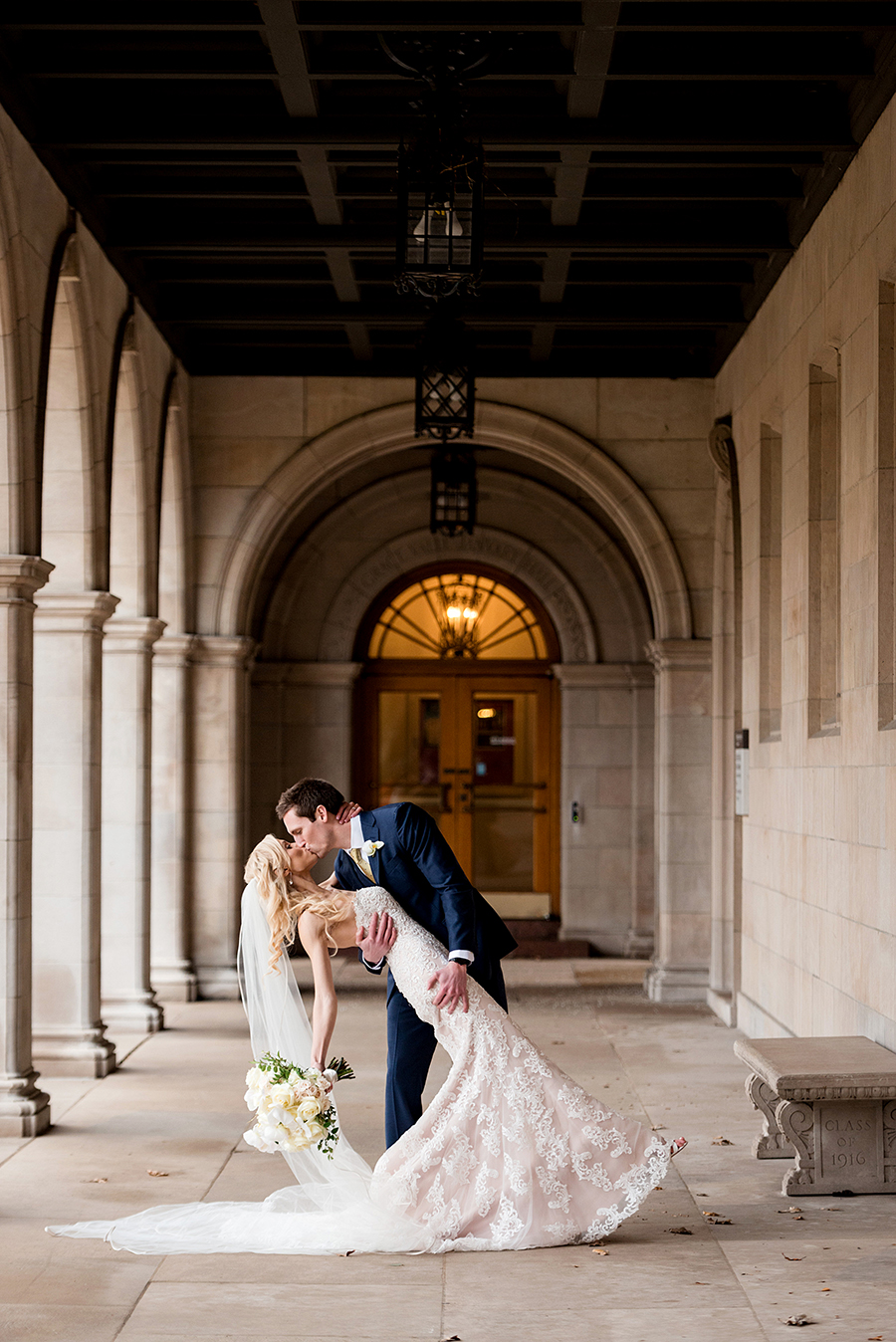 bride and groom dip at washington university for a winter wedding at graham chapel by ashley fisher photography
