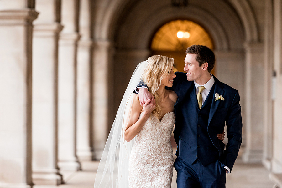bride and groom walk at washington university for a winter wedding at graham chapel by ashley fisher photography