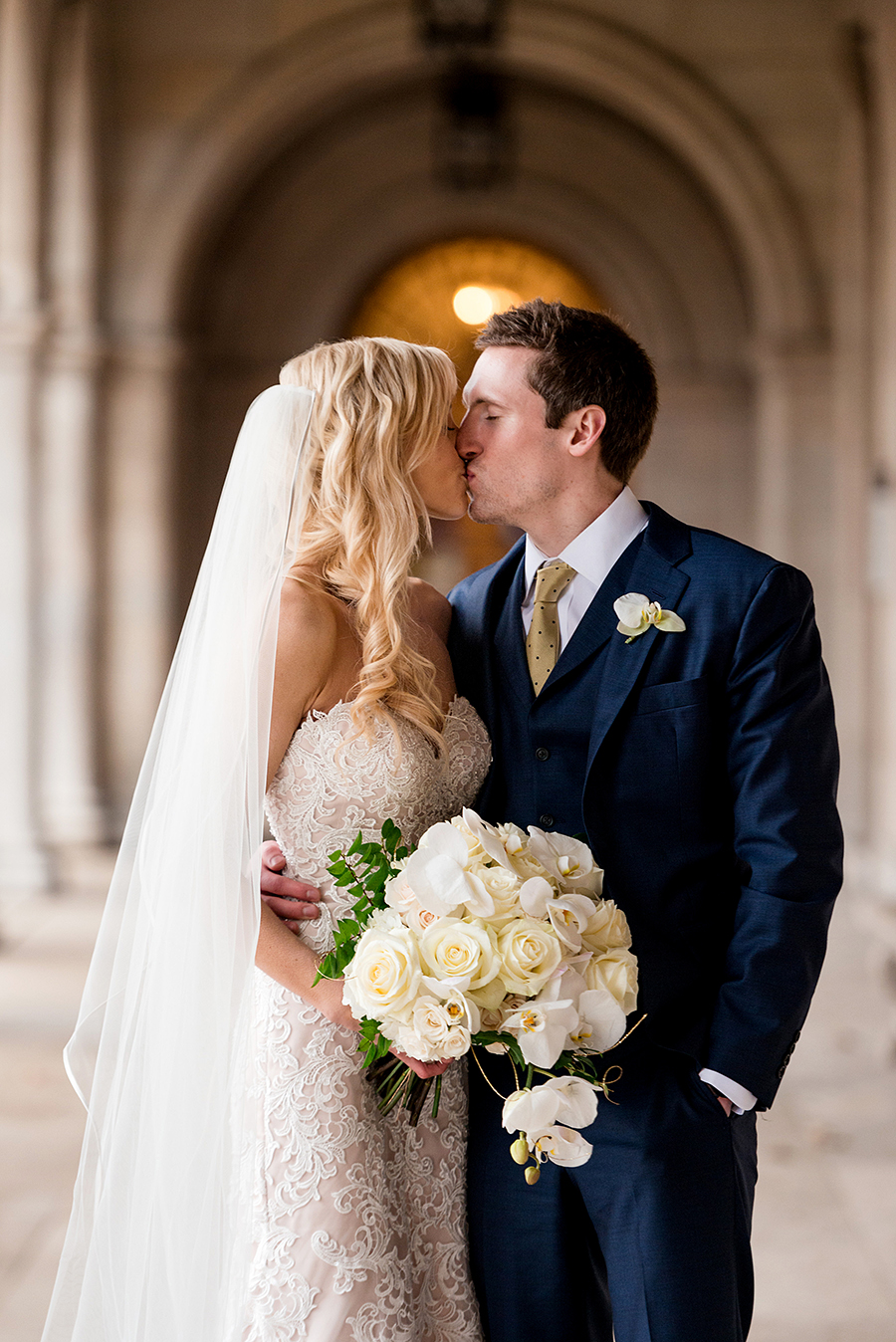 bride and groom kiss at washington university for a winter wedding at graham chapel by ashley fisher photography