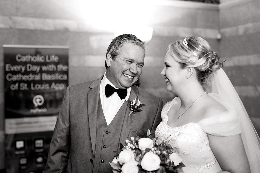 photo of bride with her dad before walking down the aisle at the cathedral basilica by ashley fisher photography