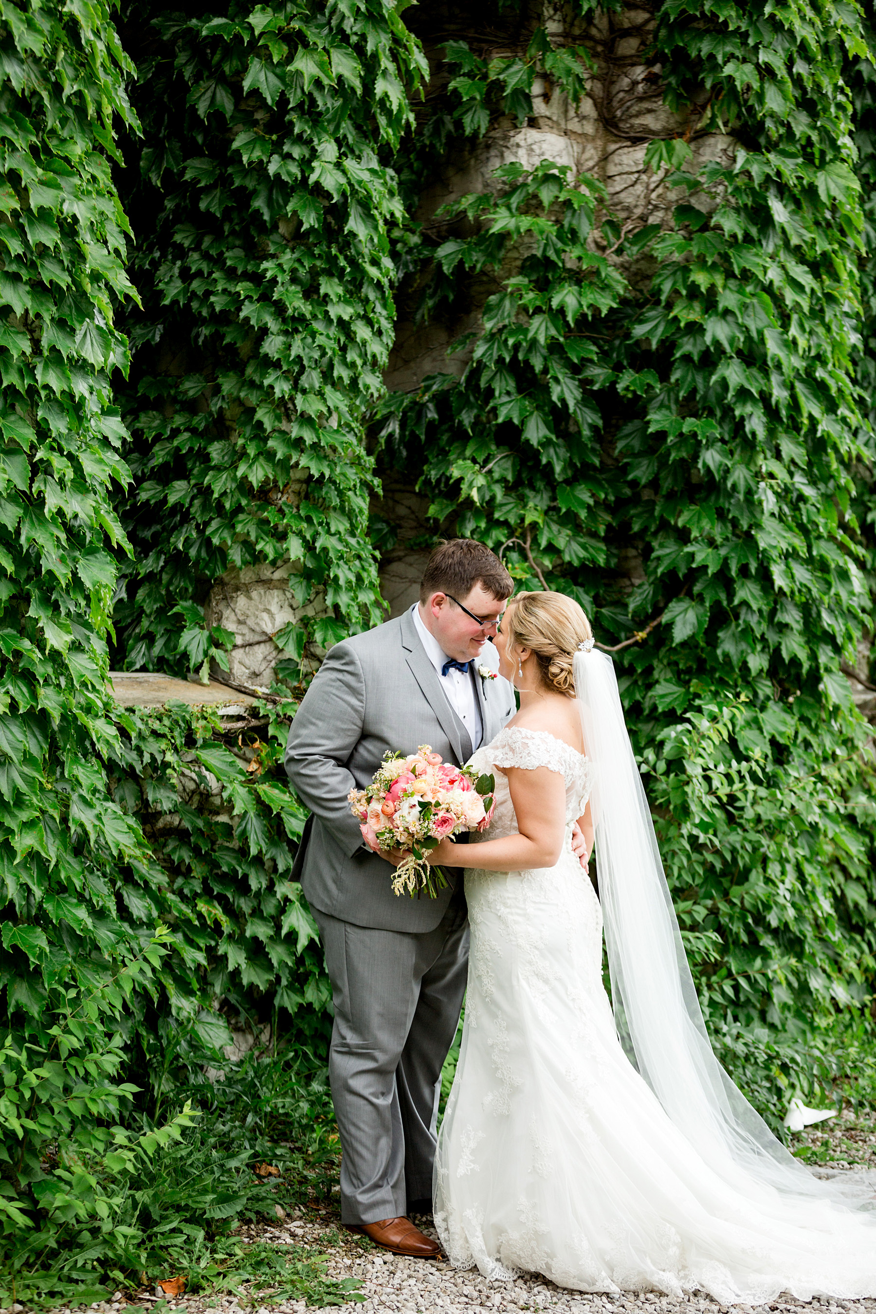 photo of bride and groom at old burned down church by ashley fisher photography