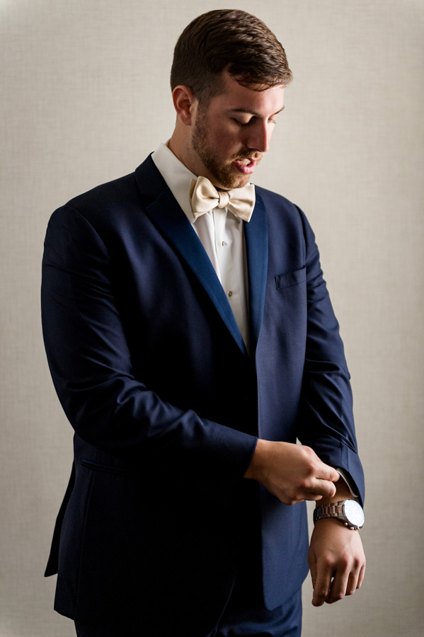 photo of groom getting ready at union station by ashley fisher photography