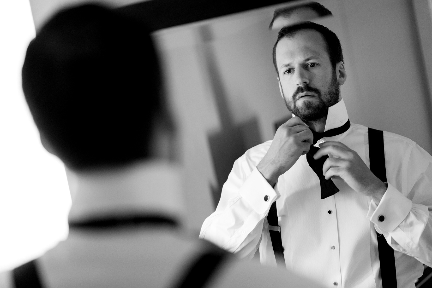 photo of groom getting ready at the chase park plaza by ashley fisher photography