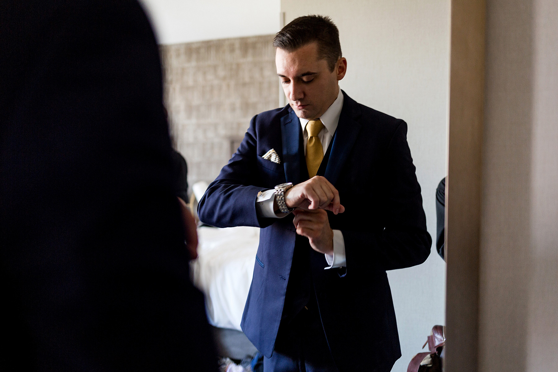 photo of groom getting ready by ashley fisher photography