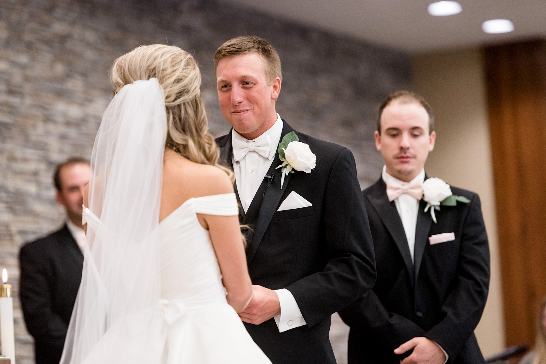 ceremony at resurrection catholic church in evansville indiana by ashley fisher photography