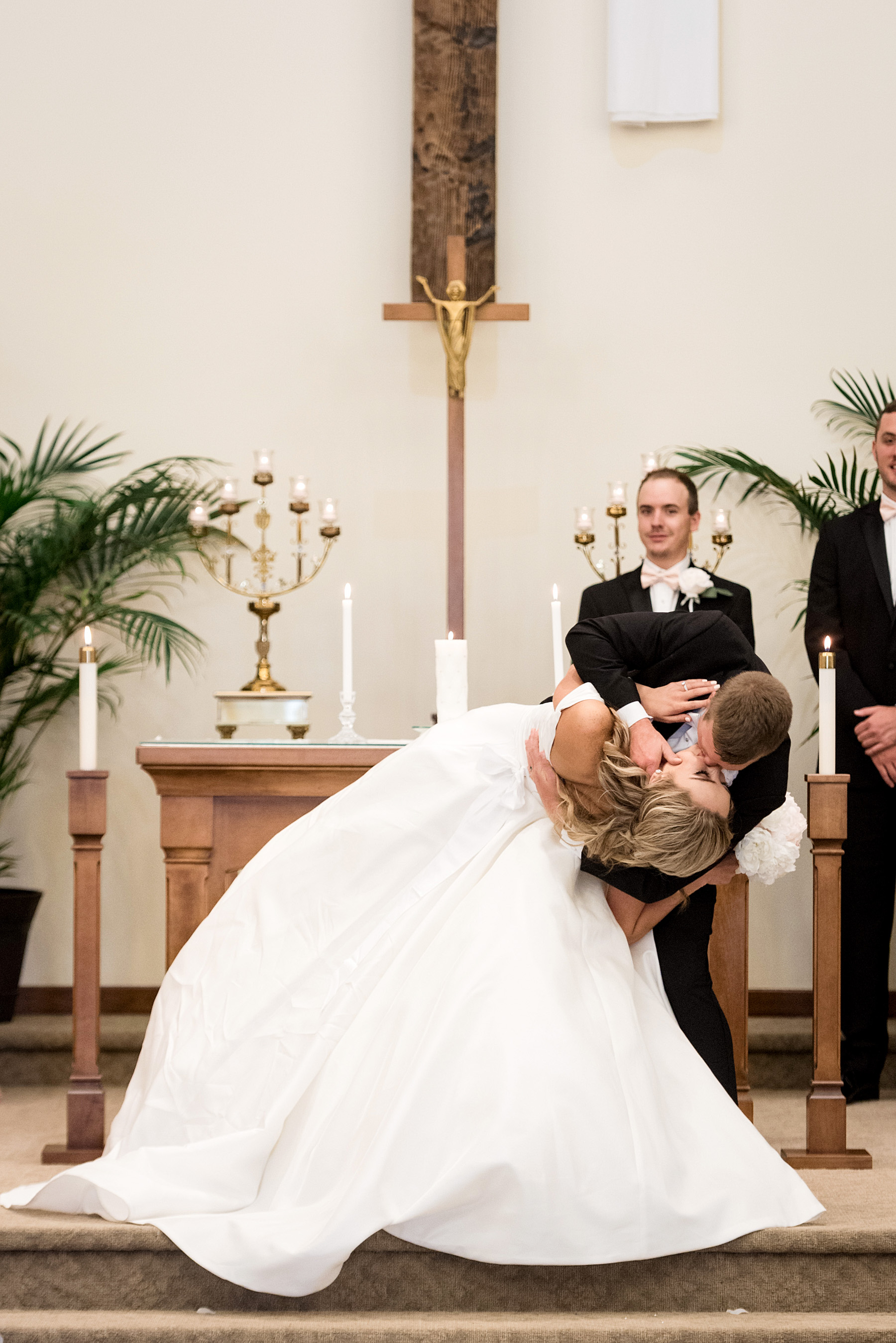 ceremony at resurrection catholic church in evansville indiana by ashley fisher photography