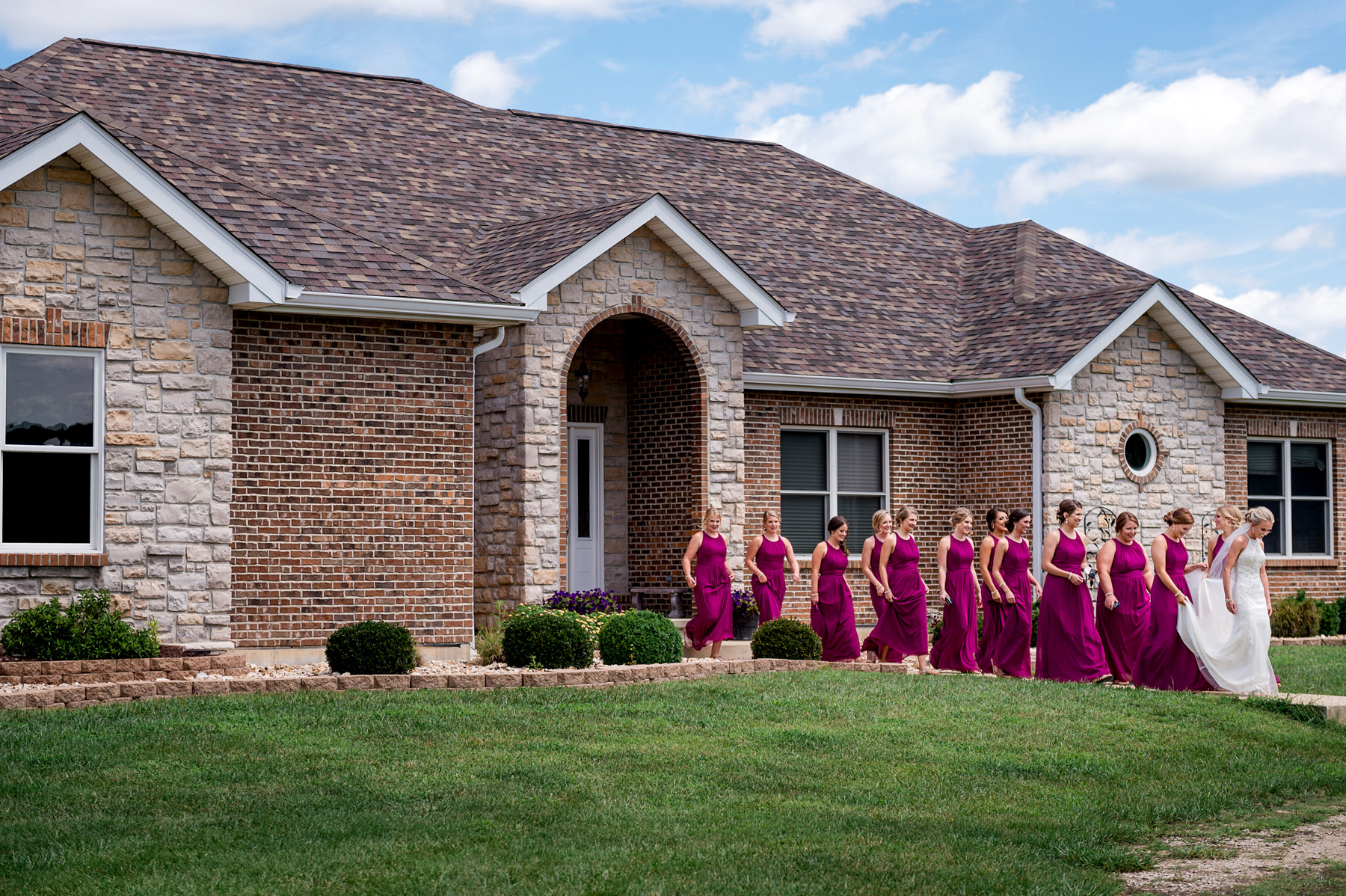 photo of bridesmaids and bride leaving house by ashley fisher photography