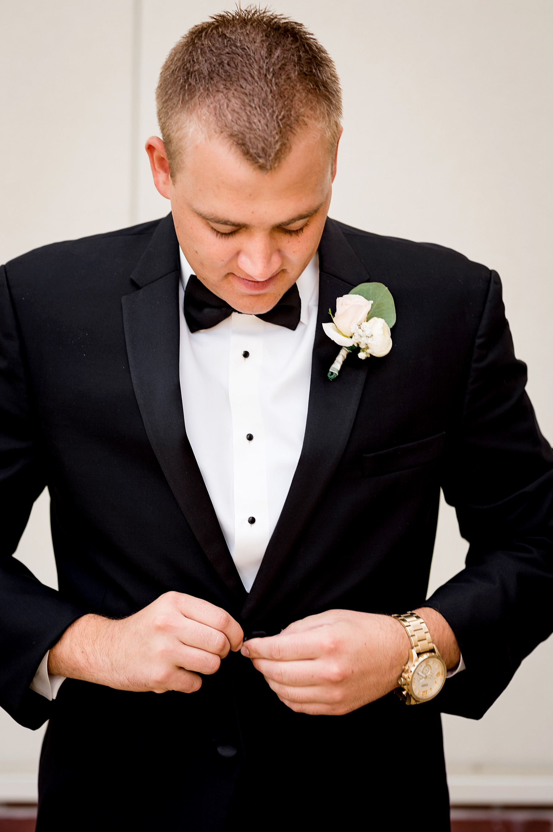photo of groom getting ready by ashley fisher photography