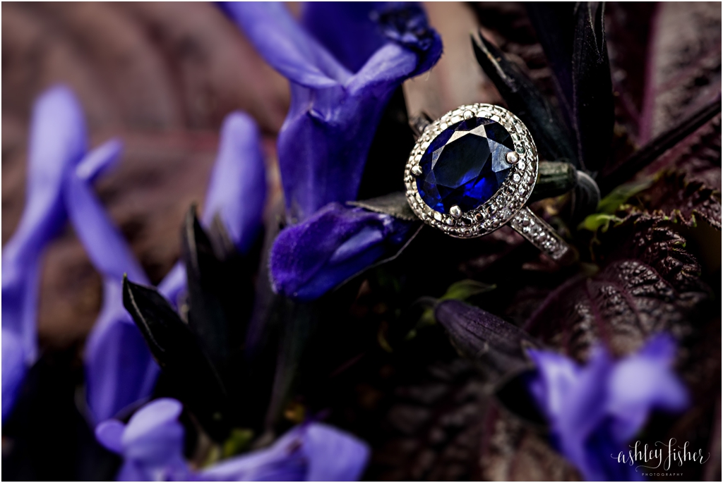 photo of blue sapphire engagement ring shot