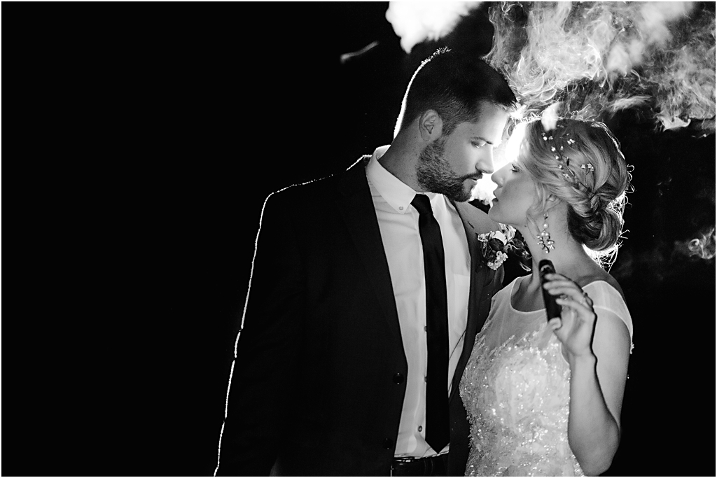 photo of bride and groom smoking cigars