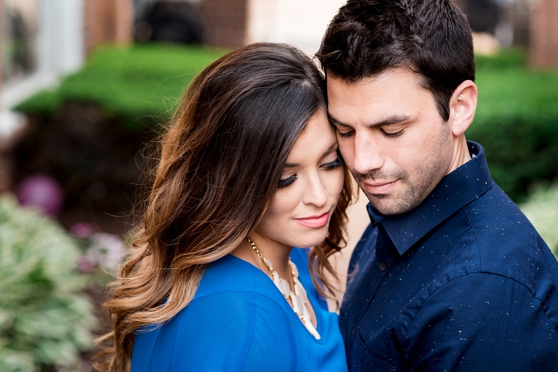 Photo of beautiful couple hugging at engagement session in Downtown Clayton`