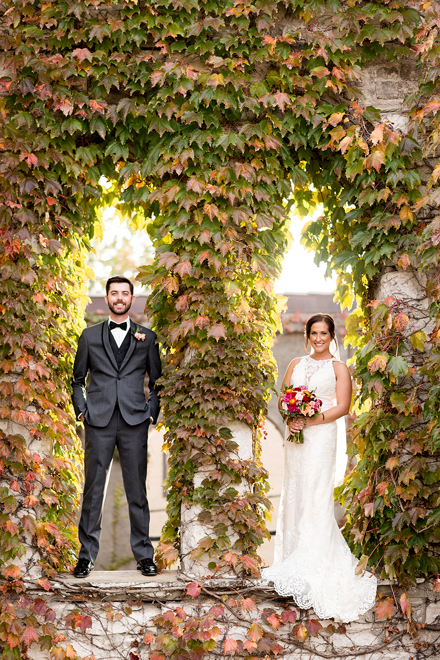 photo of couple with fall leaves by ashley fisher photography
