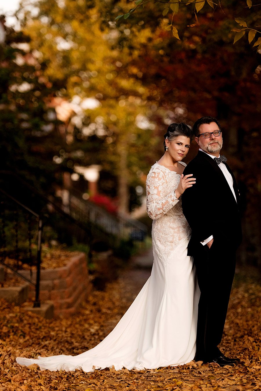 photo of couple with fall leaves by ashley fisher photography