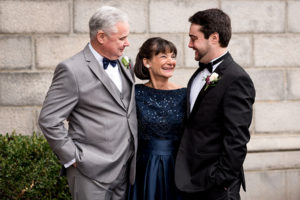 photo of groom with his parents by ashley fisher photography