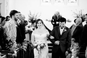 photo of bride and groom walking down the aisle by ashley fisher photography