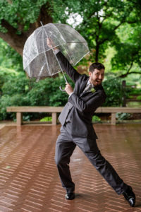 photo of groom on rainy day at MOBOT by ashley fisher photography