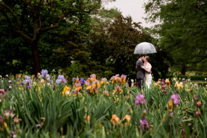 photo of bride and groom on rainy day at MOBOT by ashley fisher photography