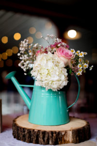 teal paint can centerpiece by ashley fisher photography