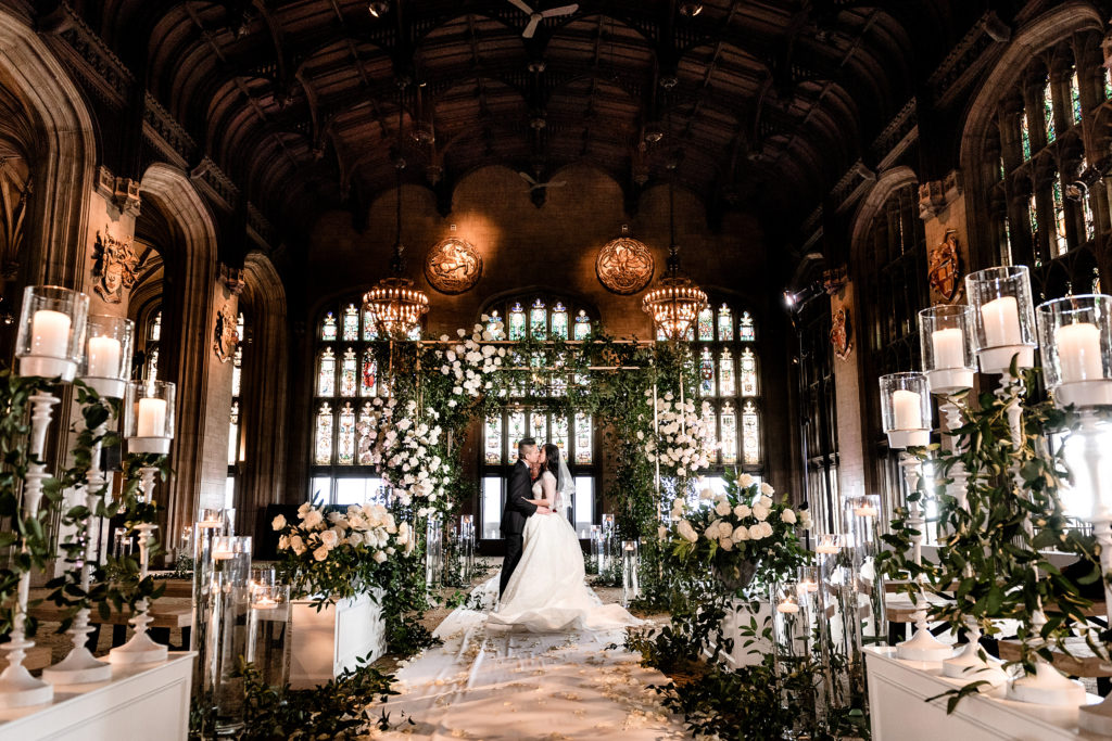 Bride and groom's first kiss during intimate elopement at University Club of Chicago