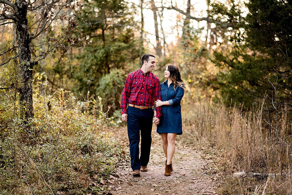 couple walking down path at elephant rock engagement session