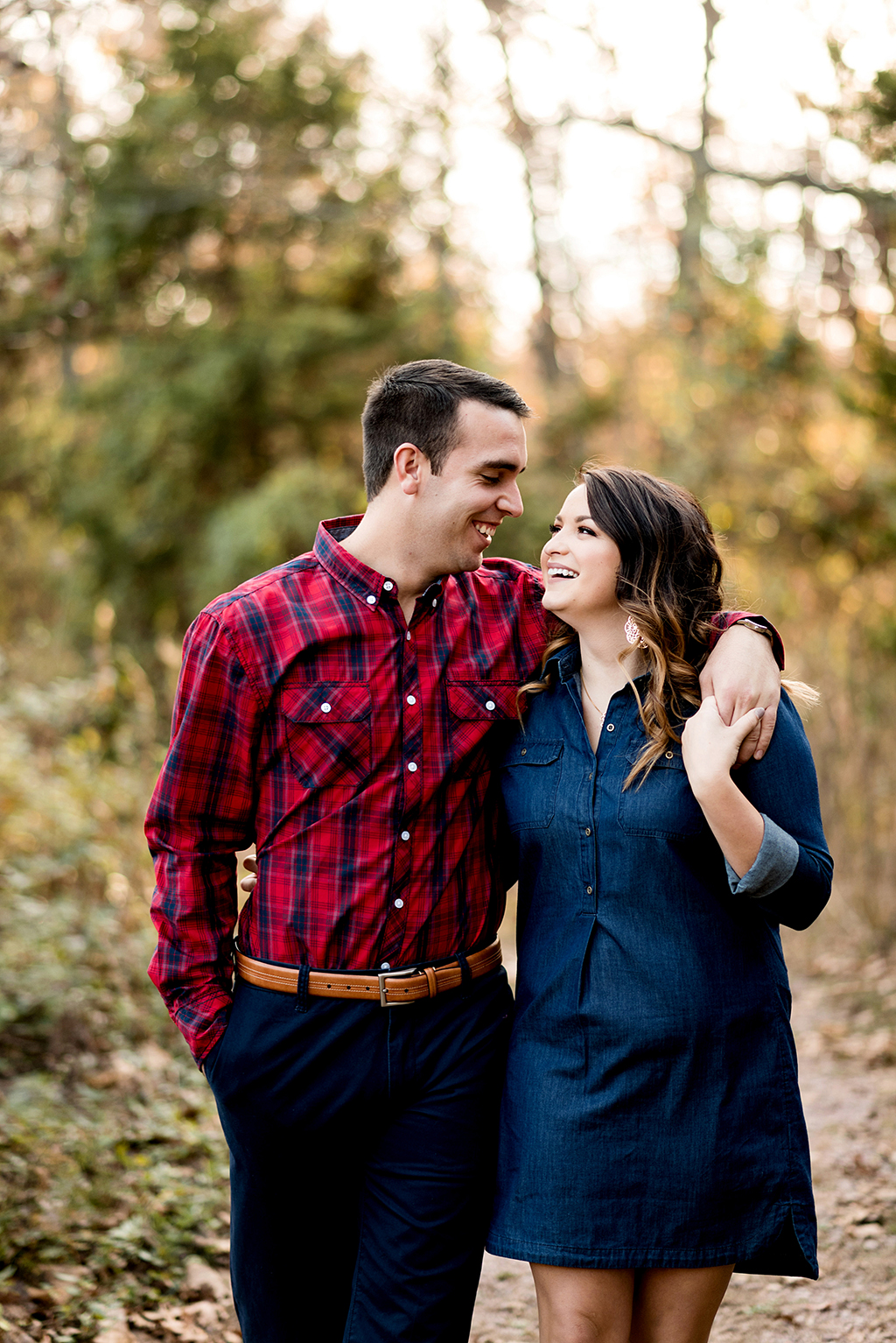 couple walking down path at elephant rock engagement session