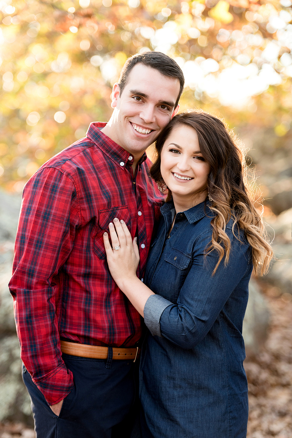 couple looking at camera during fall elephant rock state park engagement session