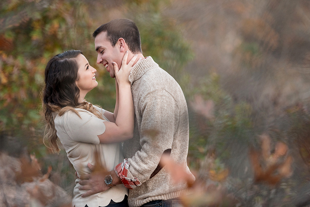 almost kiss at fall engagement session at elephant rock state park