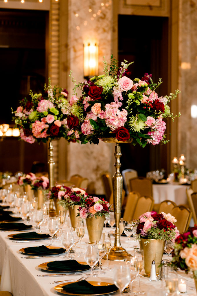 tall pink and red centerpieces by belli fiori at stifel theater wedding